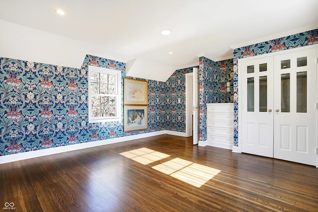 empty room with crown molding and dark hardwood / wood-style floors