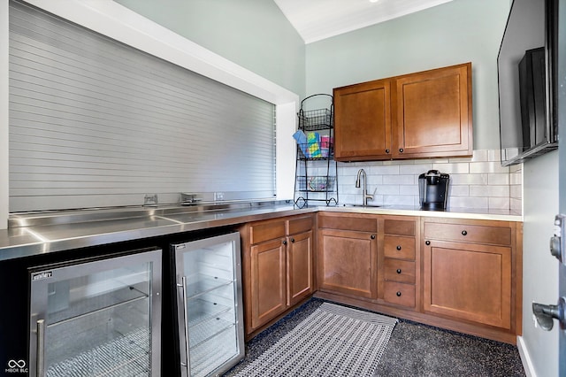 2505 Riverside Dr, Columbus, IN 47201 - kitchen featuring stainless steel counters, wine cooler, brown cabinets, and backsplash