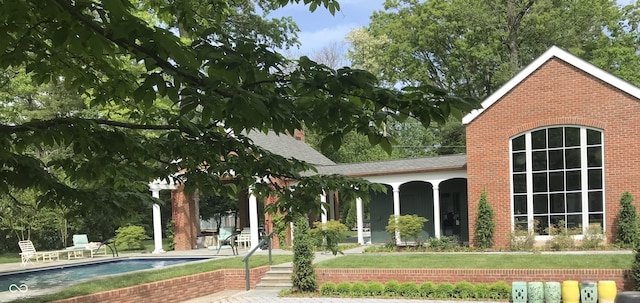 rear view of property featuring a patio