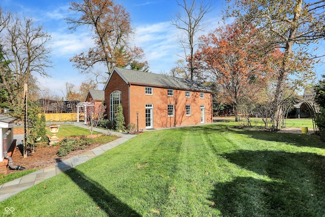 view of outbuilding featuring a lawn