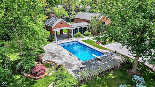 2505 Riverside Dr, Columbus, IN 47201 - swimming pool with a patio and an exterior structure