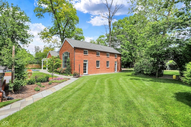 2505 Riverside Dr, Columbus, IN 47201 - rear view of house featuring brick siding and a yard