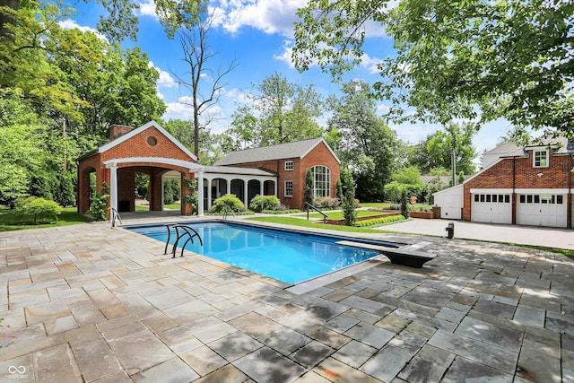 2505 Riverside Dr, Columbus, IN 47201 - swimming pool with an outbuilding, a lawn, and a patio area