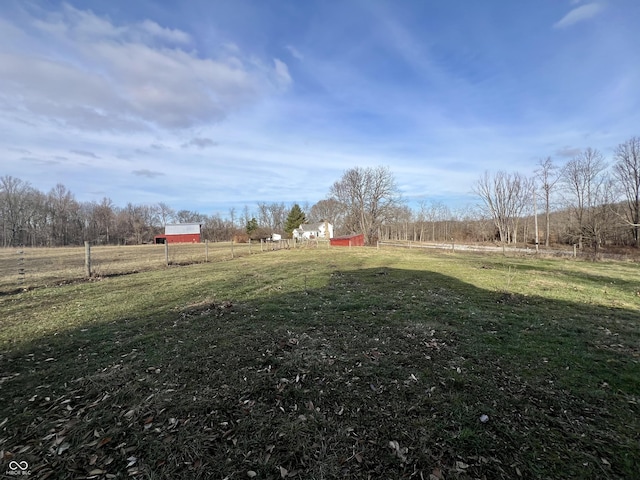 view of yard with a rural view