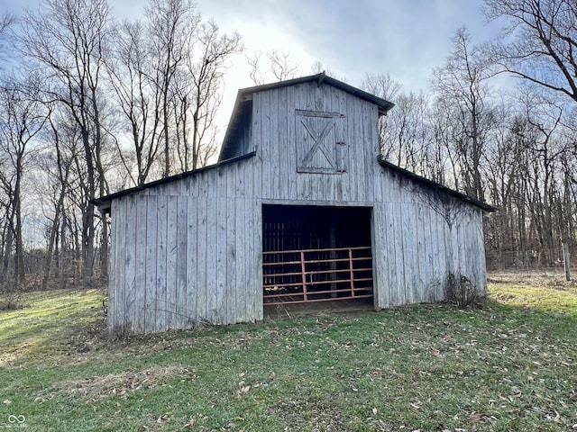 view of outbuilding with a lawn