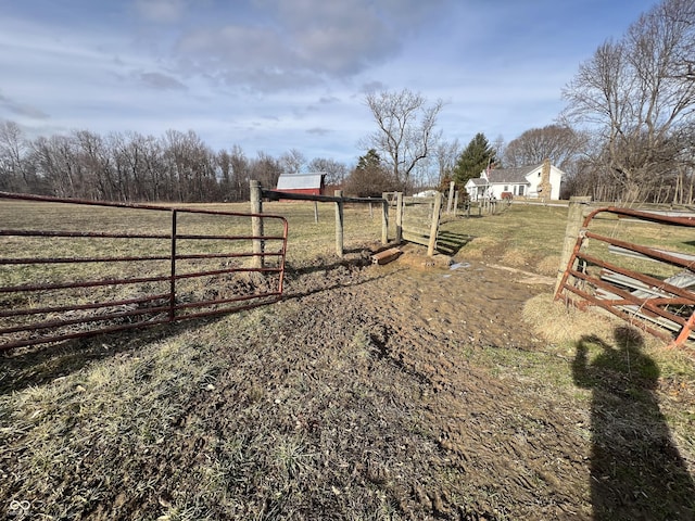 view of yard with a rural view