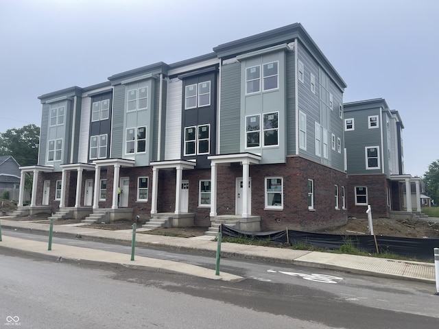 2609 E New York St, Indianapolis, IN 46201 - townhome / multi-family property featuring brick siding