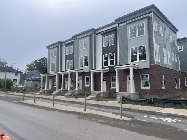 2609 E New York St, Indianapolis, IN 46201 - townhome / multi-family property featuring brick siding