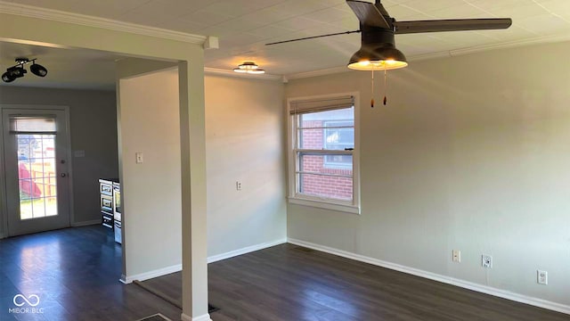 unfurnished room featuring dark wood-type flooring, crown molding, a wealth of natural light, and ceiling fan