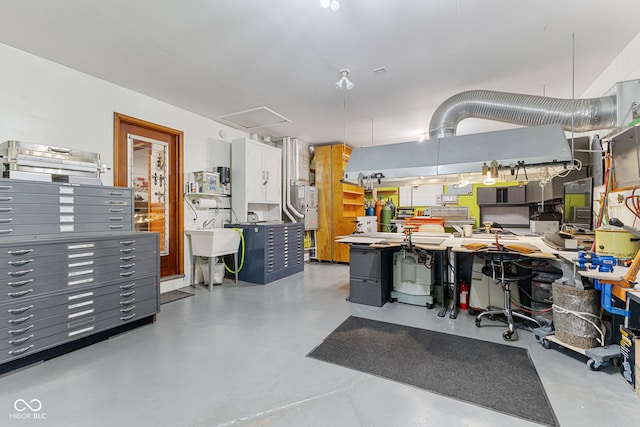 kitchen with kitchen peninsula, white cabinetry, and sink