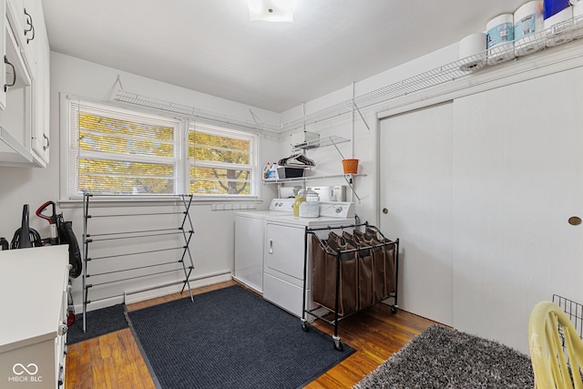 laundry room with dark wood-type flooring and washing machine and clothes dryer