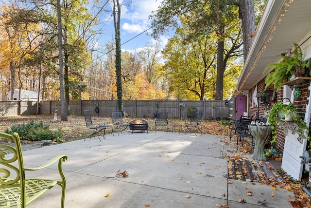 view of patio with a fire pit