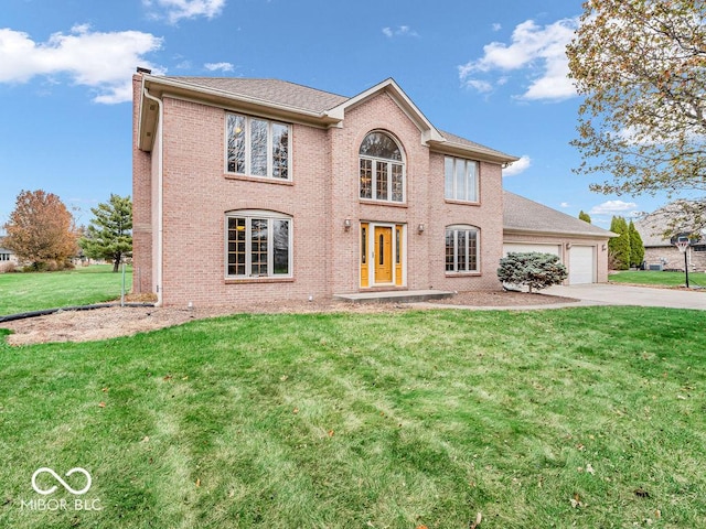 front facade featuring a front yard and a garage