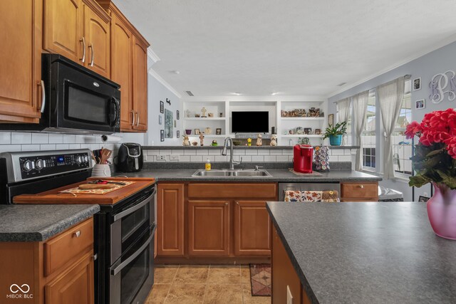 kitchen featuring decorative backsplash, appliances with stainless steel finishes, built in features, crown molding, and sink