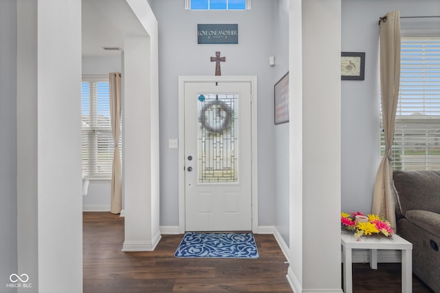 foyer with dark hardwood / wood-style floors