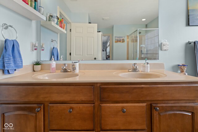 bathroom with vanity and an enclosed shower