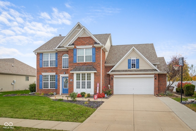 view of front of home featuring a front lawn and a garage