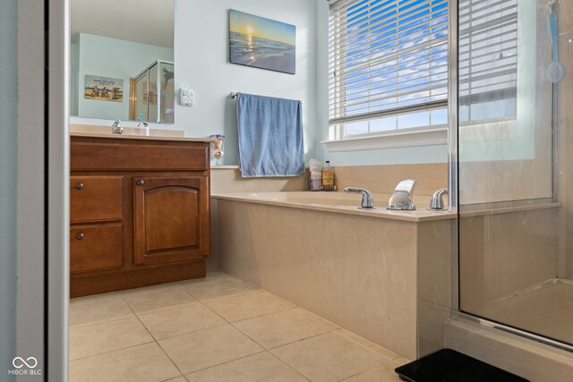 bathroom with vanity, tile patterned floors, and a shower with shower door