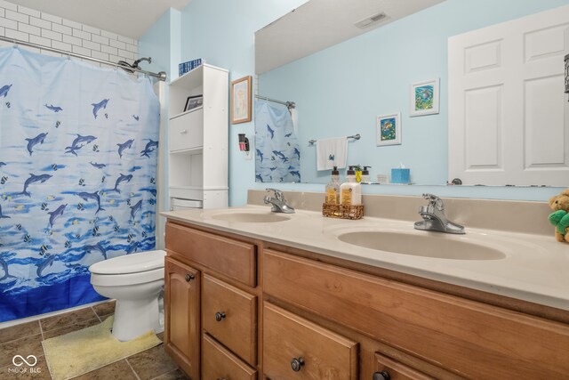 bathroom with vanity, a shower with shower curtain, and toilet