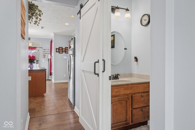 bathroom with vanity and hardwood / wood-style floors