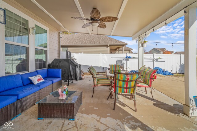 view of patio with an outdoor living space and ceiling fan