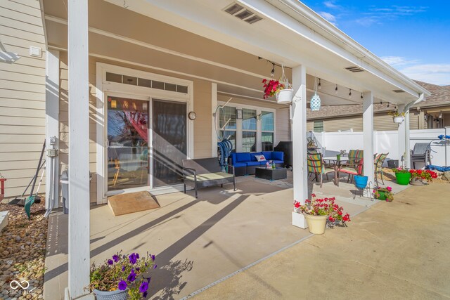 doorway to property featuring a patio and an outdoor hangout area