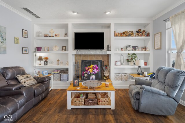 living room with ornamental molding, dark wood-type flooring, a fireplace, and built in features