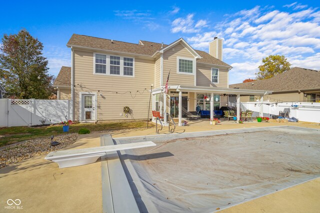 back of house featuring a patio