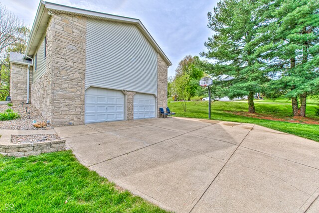 view of property exterior with a lawn and a garage