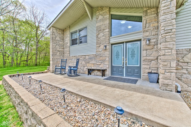 doorway to property with a patio area