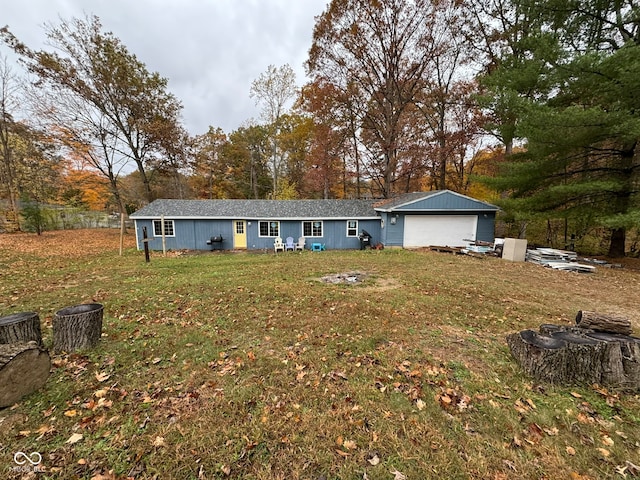 ranch-style home featuring a front yard and an outbuilding