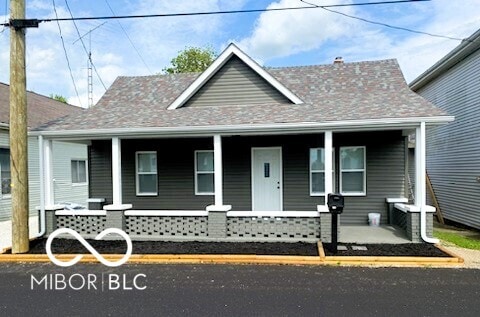 12544 S State Road 3, Westport, IN 47283 - view of front of home with covered porch and roof with shingles
