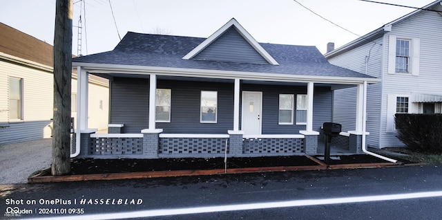 12544 S State Road 3, Westport, IN 47283 - view of front of house featuring a porch and a shingled roof