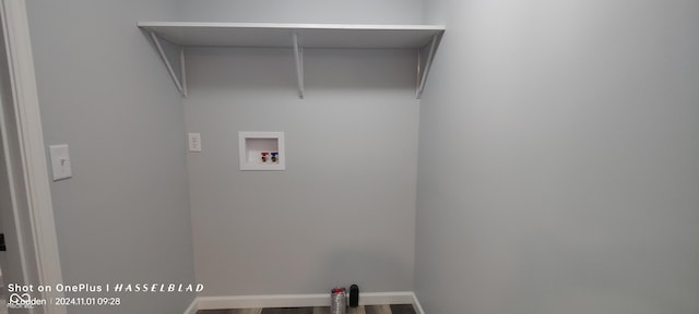 12544 S State Road 3, Westport, IN 47283 - laundry area featuring washer hookup, wood finished floors, and baseboards