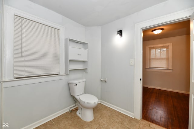 bathroom featuring tile patterned flooring and toilet