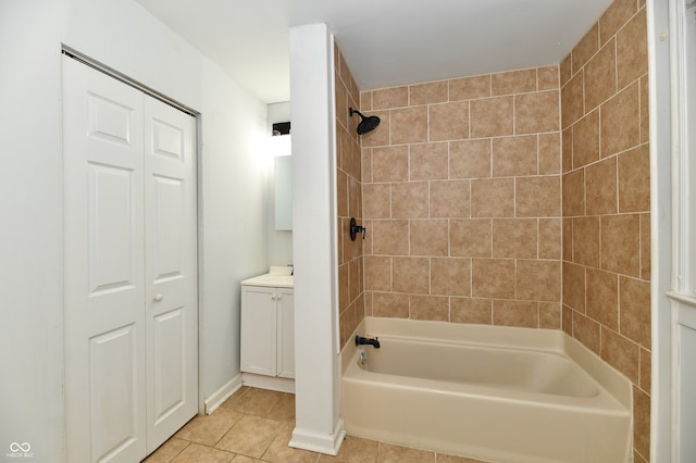 bathroom featuring tile patterned floors, vanity, and tiled shower / bath combo