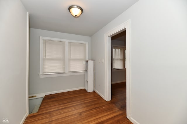 hall with dark hardwood / wood-style floors