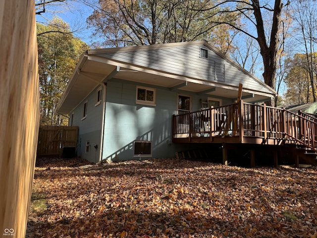 back of house with a deck