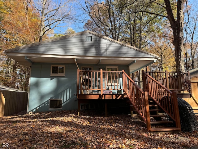 back of property with a wooden deck