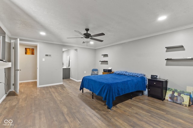 bedroom featuring crown molding, dark hardwood / wood-style floors, a textured ceiling, and ceiling fan