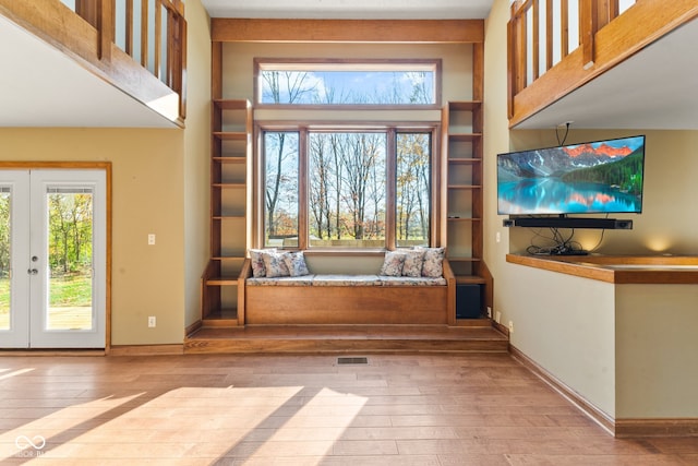 doorway with french doors and light wood-type flooring