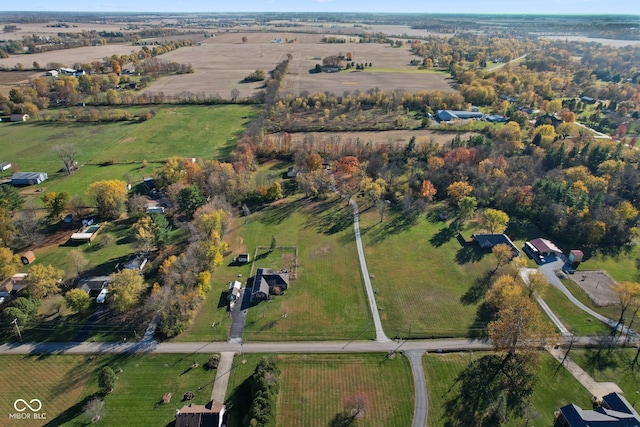 birds eye view of property with a rural view