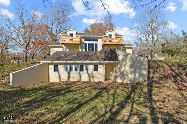 back of house with a yard