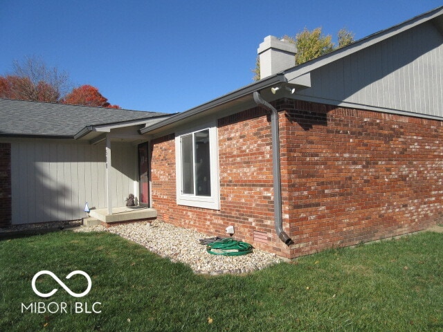 view of home's exterior with a yard