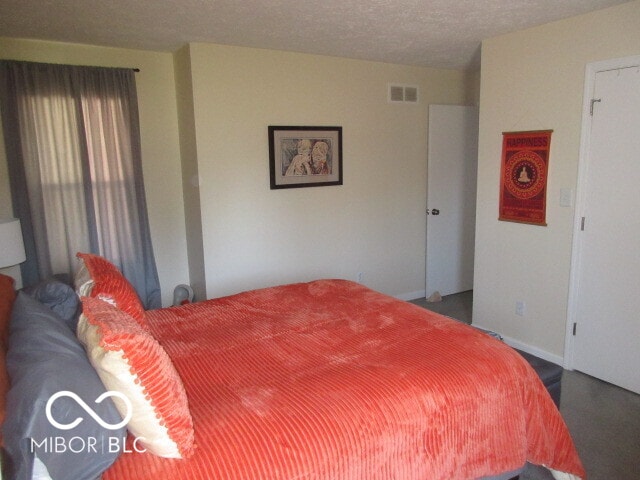 bedroom featuring a textured ceiling