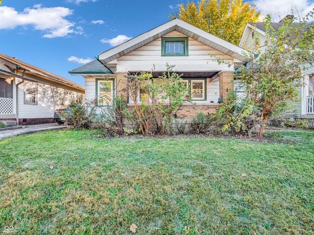 bungalow with a front lawn