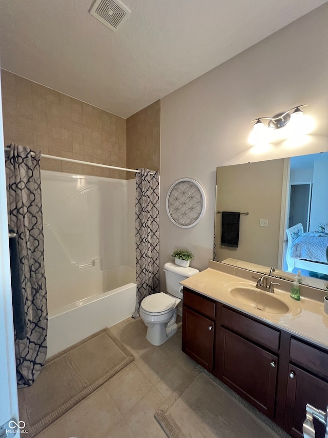 full bathroom featuring vanity, shower / tub combo with curtain, tile patterned flooring, and toilet