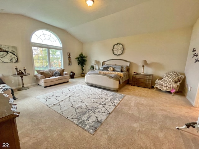 bedroom with carpet flooring and lofted ceiling