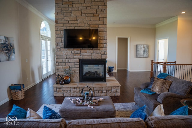 living room with a fireplace, dark hardwood / wood-style flooring, and ornamental molding