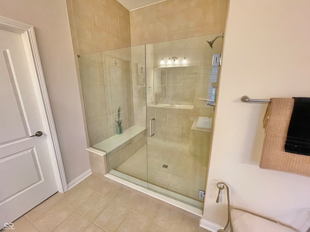 bathroom featuring walk in shower and tile patterned flooring